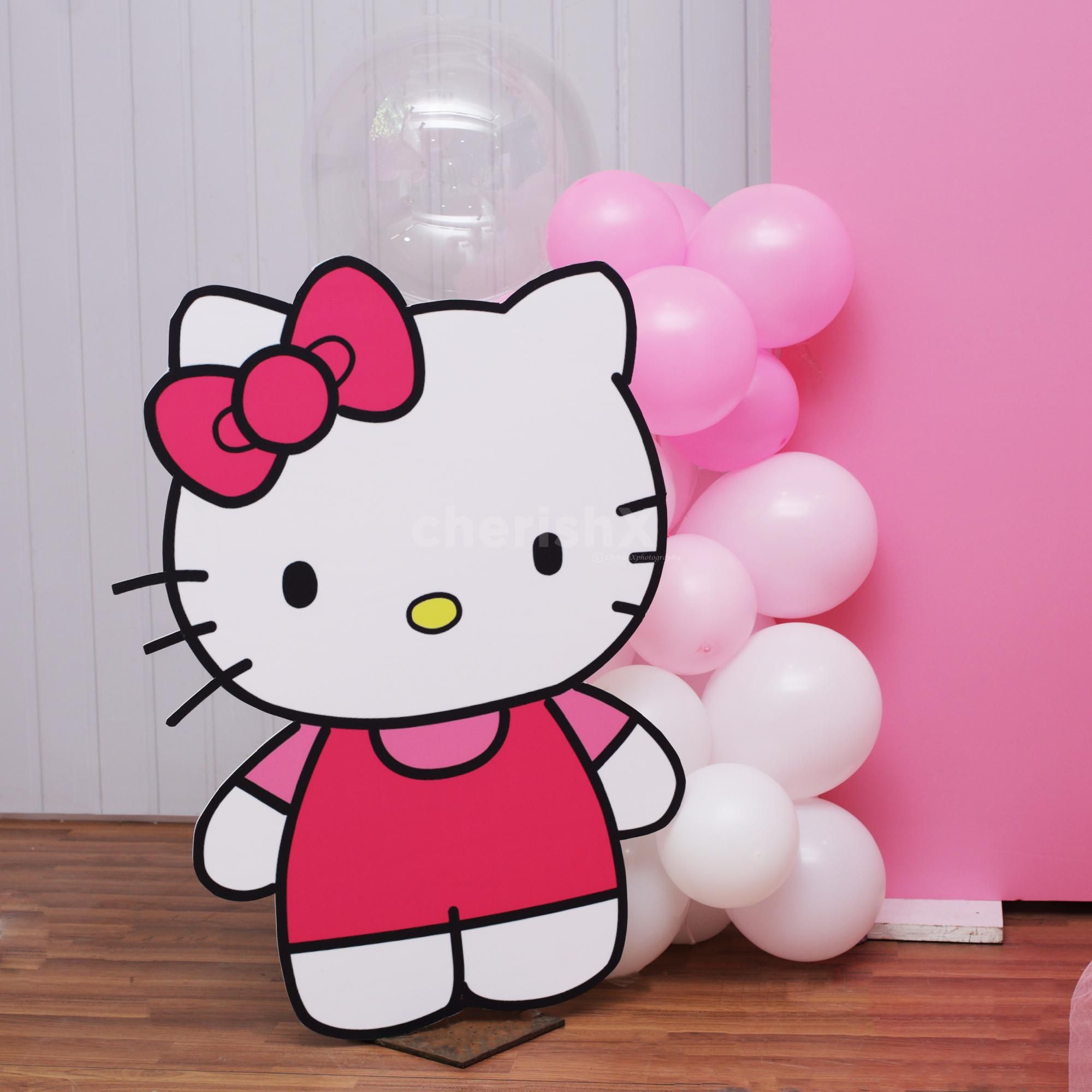 Balloon arch surrounding the setup with softness and color.