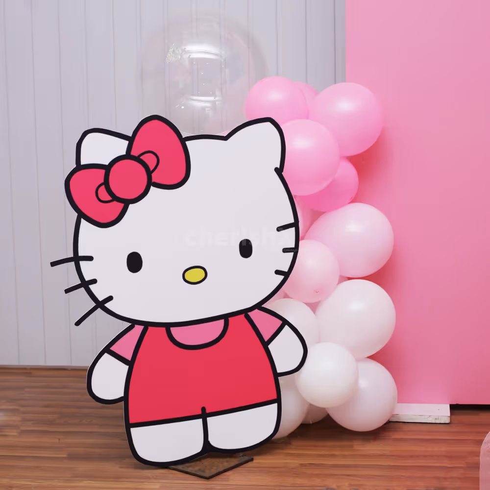 Balloon arch surrounding the setup with softness and color.