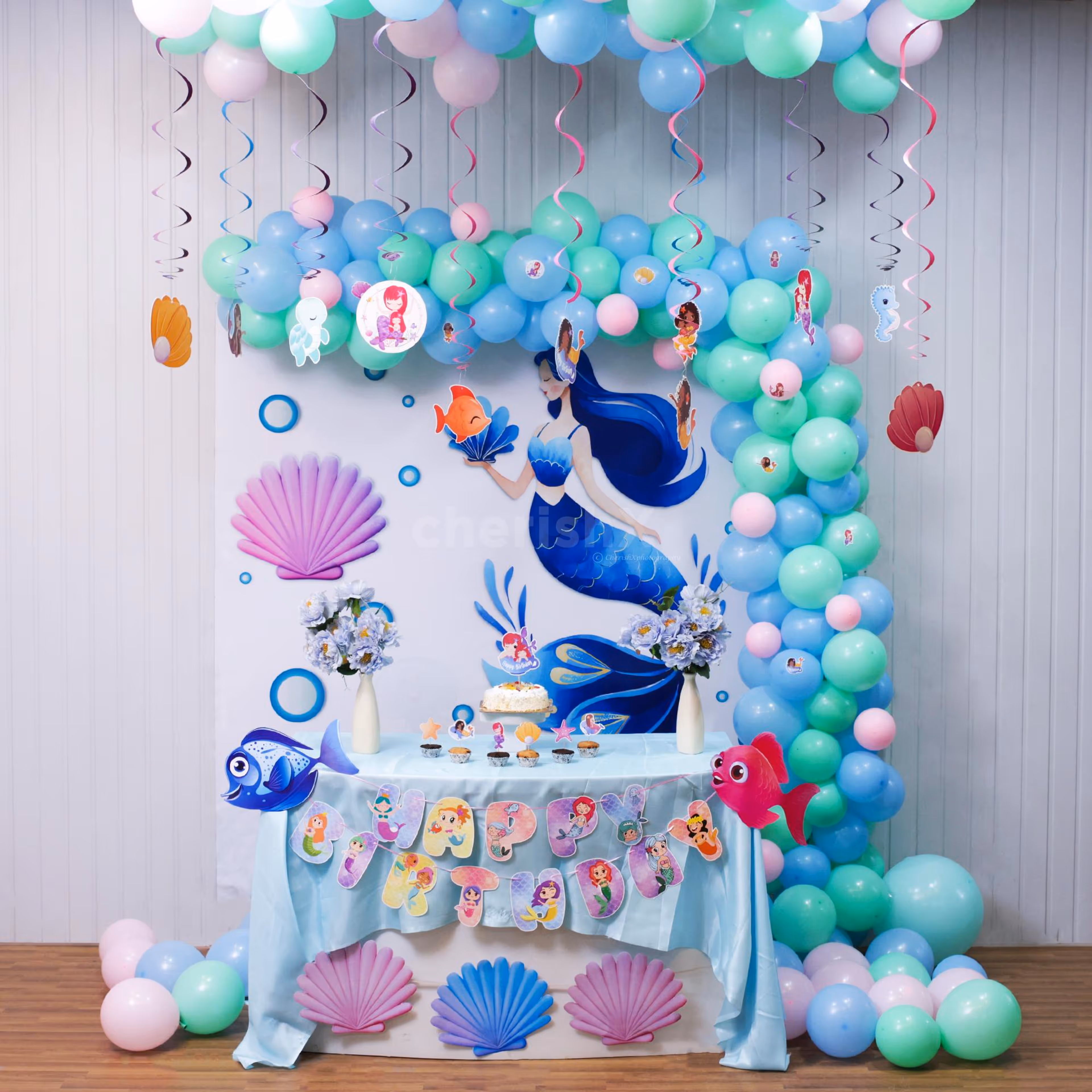 Fish swam in frosting while shells guarded the cupcake stash