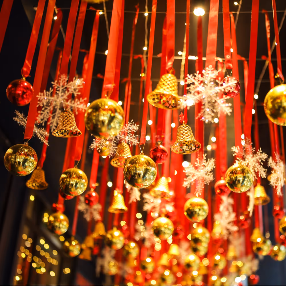 Snowflake ornaments with red ribbons add winter's magic to overhead decoration