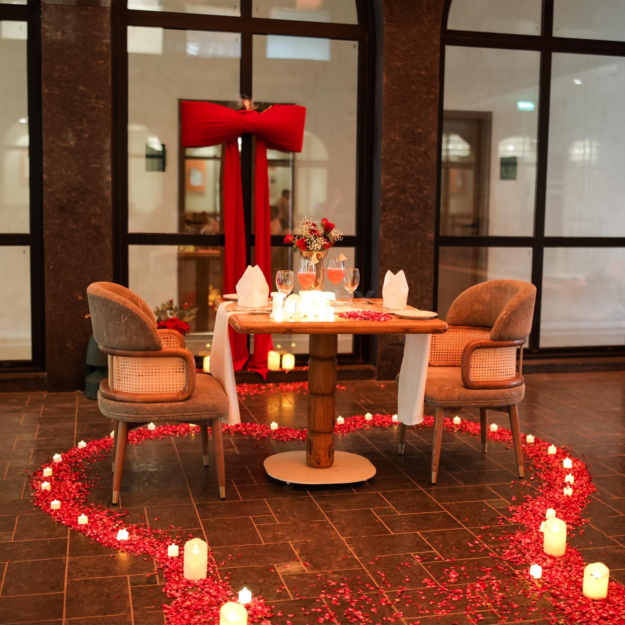 A romantic private courtyard setup with candlelight and floral decor