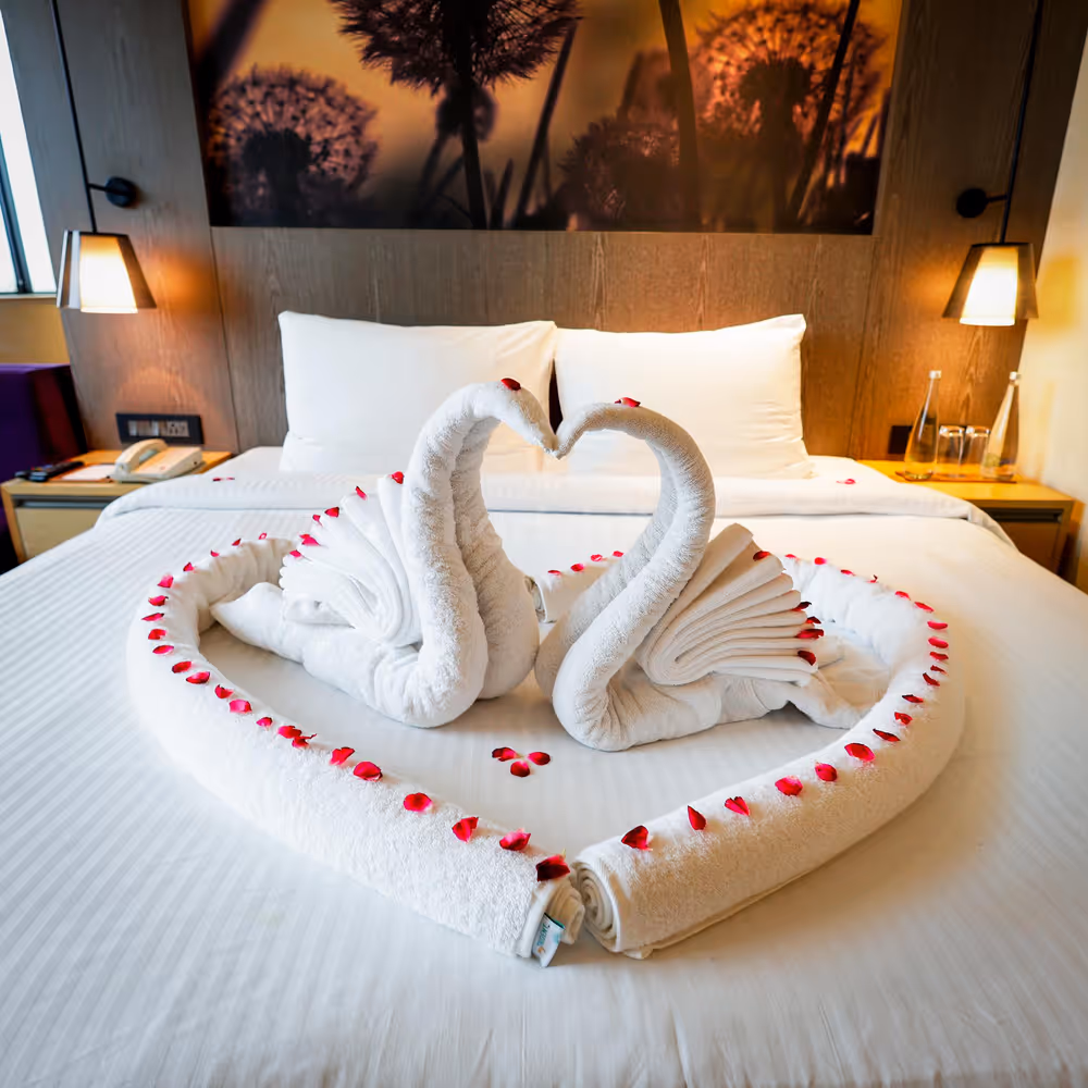 towel art on bed, romantic staycation in noida for couples