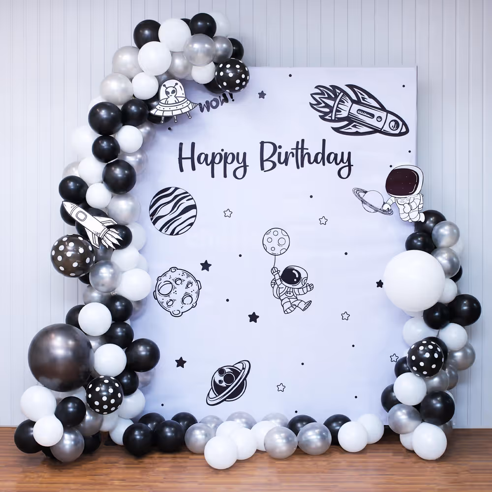 Glowing galaxy flex backdrop under a neon birthday sign.