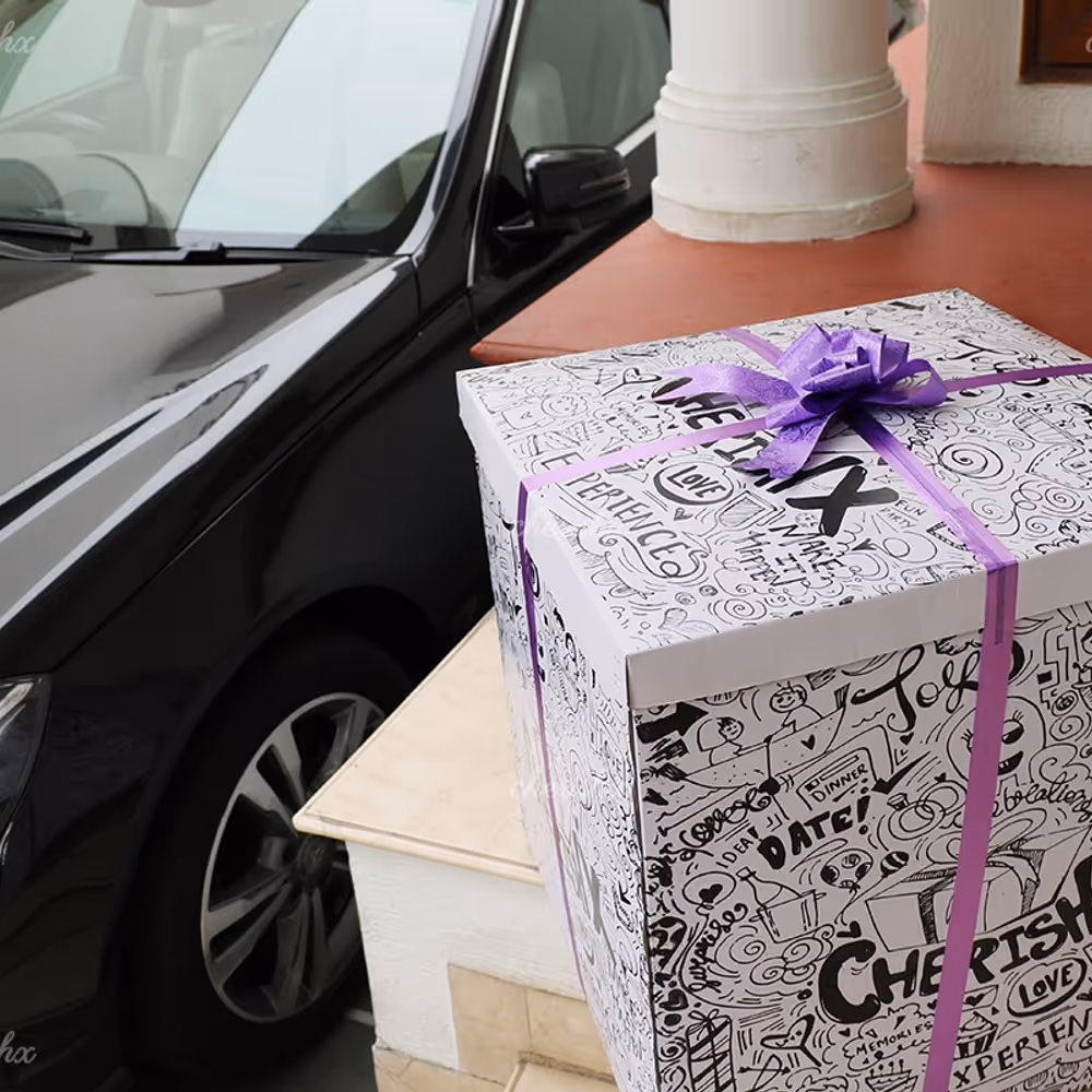 A surprise box packed with a purple ribbon.