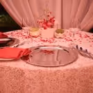 Table Decoration with petals and candles to give a romantic feel to your dinner date.