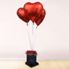 A Red Rose Bucket with heart balloons to shower love upon your close ones.