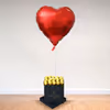 A box of happiness
in the form of chocolates and a heart-shaped balloon.