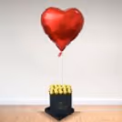 A box of happiness
in the form of chocolates and a heart-shaped balloon.