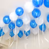 The ceiling is filled with blue and white balloons to give an appealing look to the whole room.