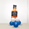 A Whiskey Bottle Foil Balloon on a bunch of balloons to add to the decor.