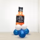 A Whiskey Bottle Foil Balloon on a bunch of balloons to add to the decor.