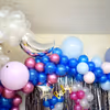Exclusive Royal Baby Shower Decor with colourful balloons including blue, pink and white chrome and metallic balloons.