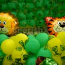 Tiger and Lion Foil Balloons surrounded by green and yellow balloons to give the look of a Jungle.