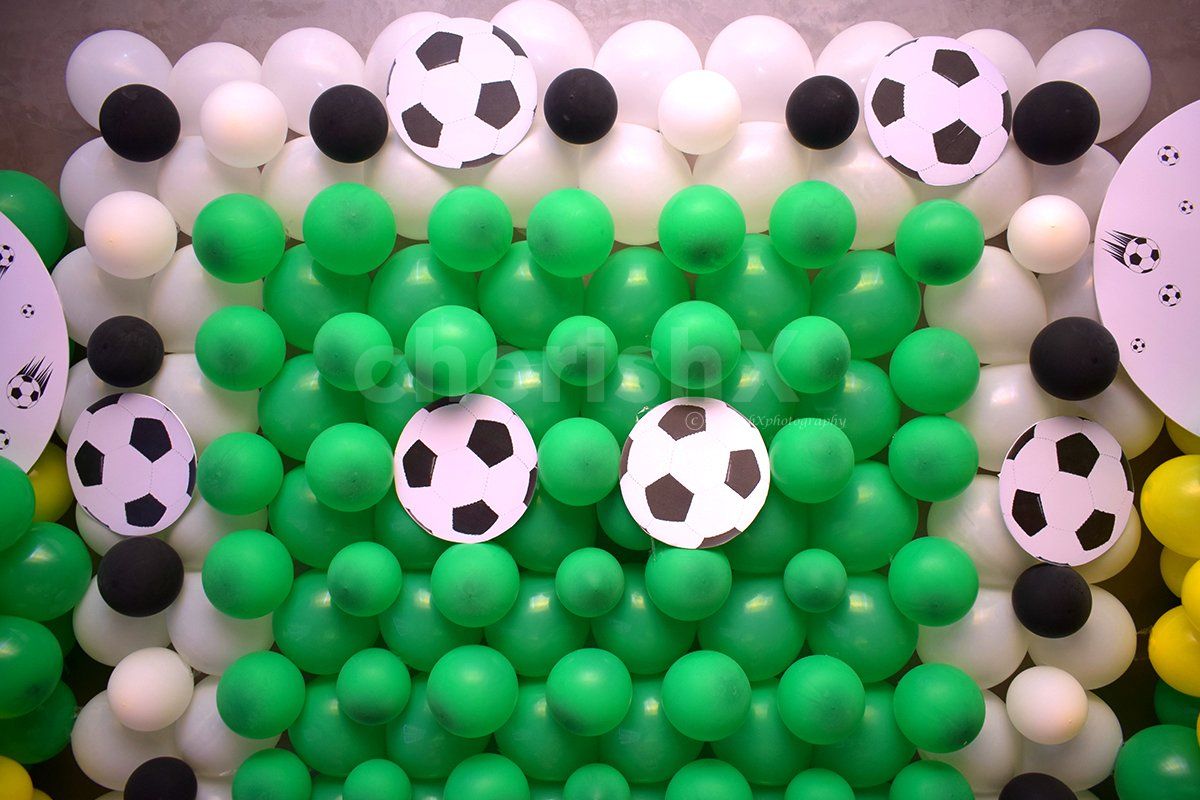 The wall decor is filled with bunches of balloons to enhance the overall look of the room decor.