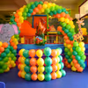 A dome-like structure made up of balloons with different colours to make the decor look attractive.