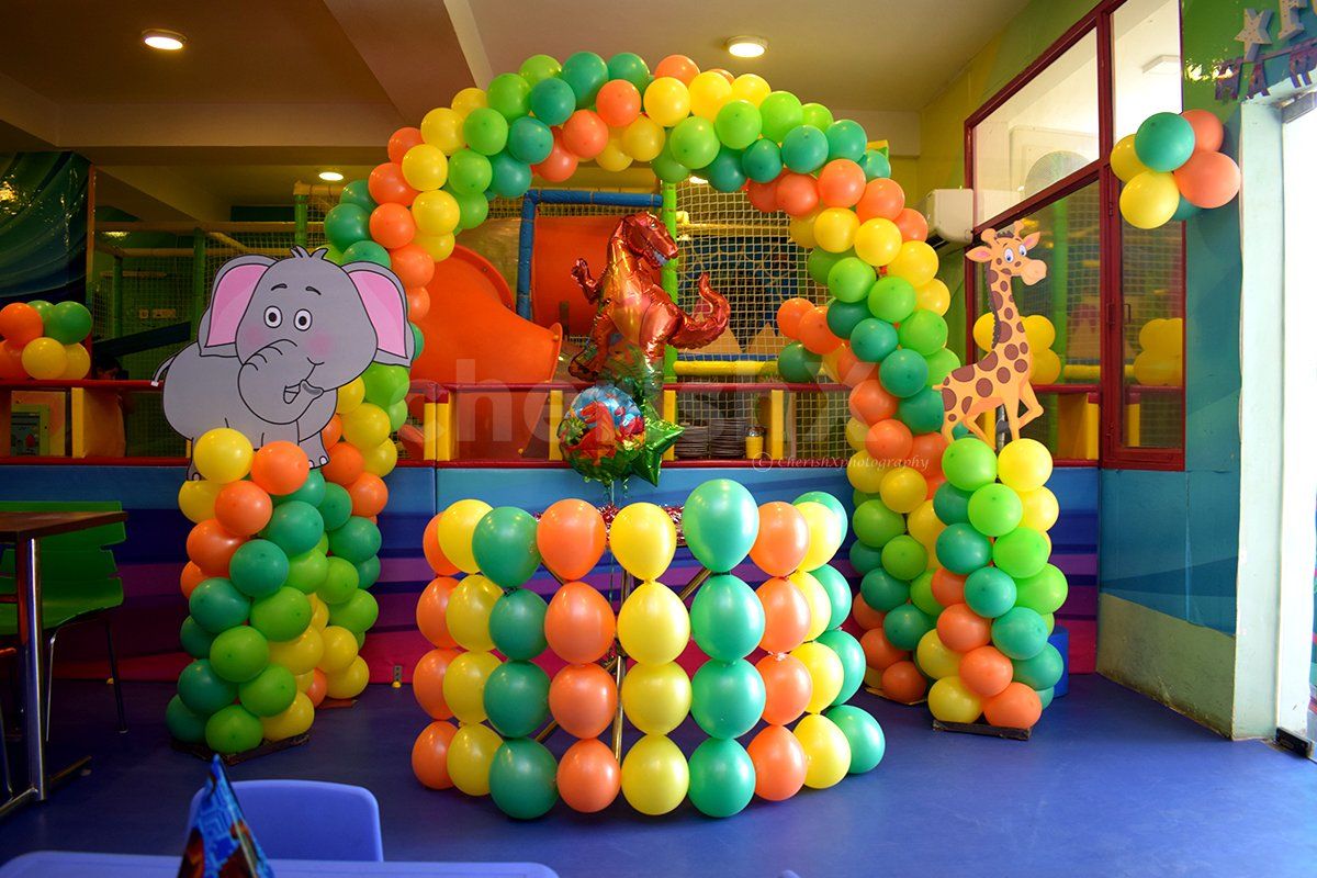 Bunches of balloons are used to make this whole photo booth.