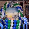 Balloon arc, a backdrop and cricket personality cut-outs for a photo booth.