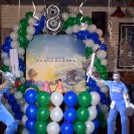 Balloon arc, a backdrop and cricket personality cut-outs for a photo booth.