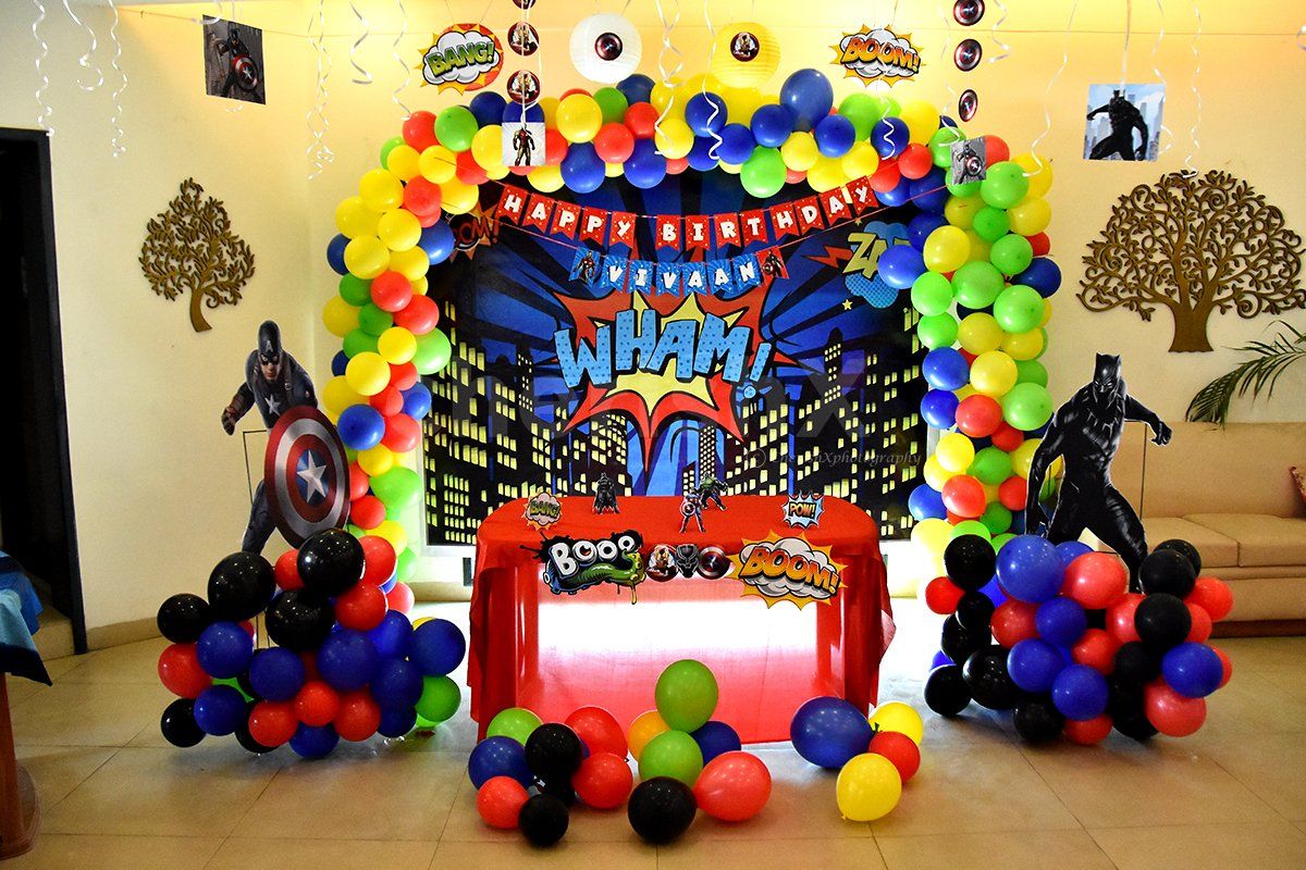 Book this fulfiling decor with balloons and superhero-themed cut-outs.