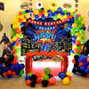 Book this fulfiling decor with balloons and superhero-themed cut-outs.
