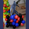 A Black Panther Cut-out stand on a colourful balloon bunch.