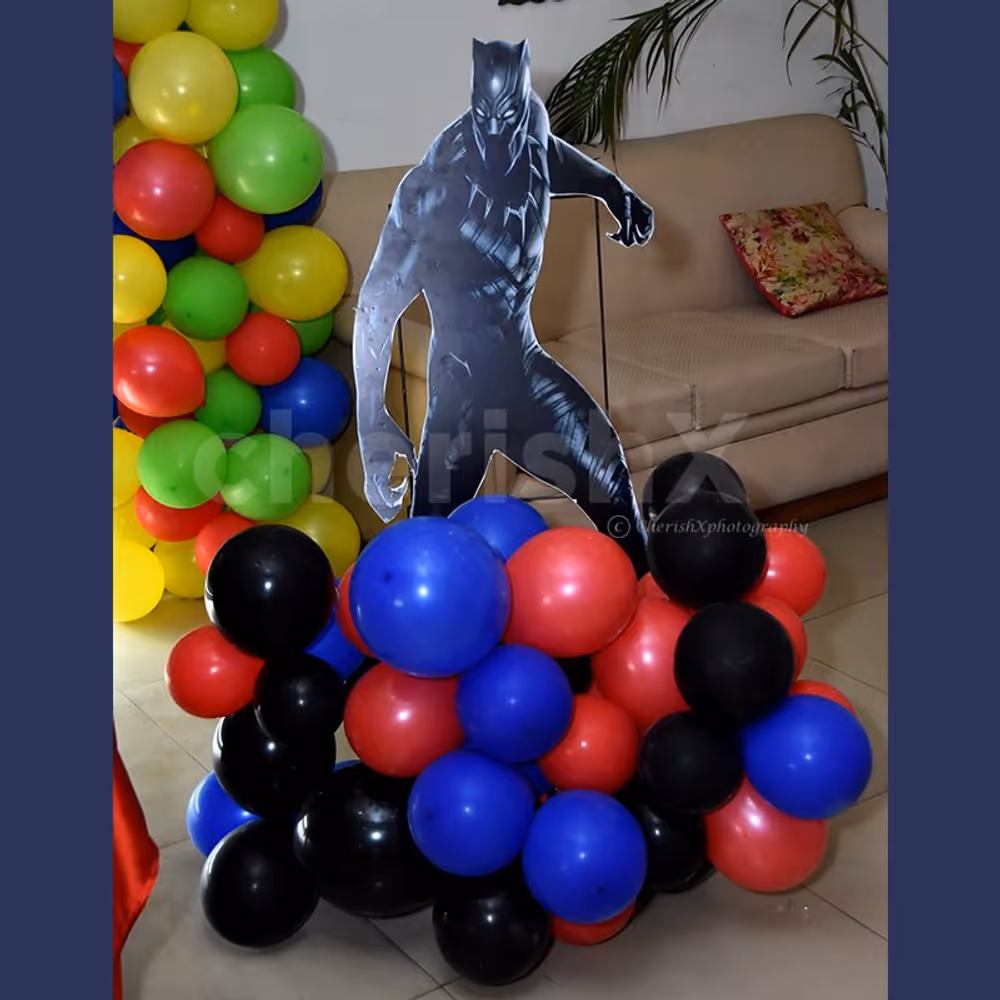 A Black Panther Cut-out stand on a colourful balloon bunch.