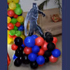 A Black Panther Cut-out stand on a colourful balloon bunch.