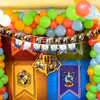The Harry Potter Wall Decor with Harry Potter Themed Bunting and the four famous Houses in the Howgwarts.