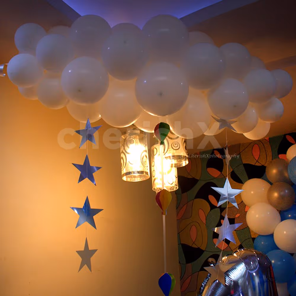 Inspired by Disney's Up, the white bunches of balloons depict the cloud in the overall room decoration.