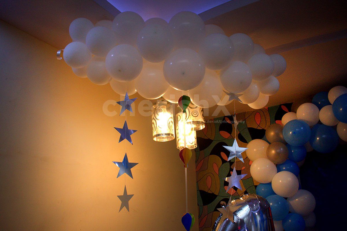 Inspired by Disney's Up, the white bunches of balloons depict the cloud in the overall room decoration.