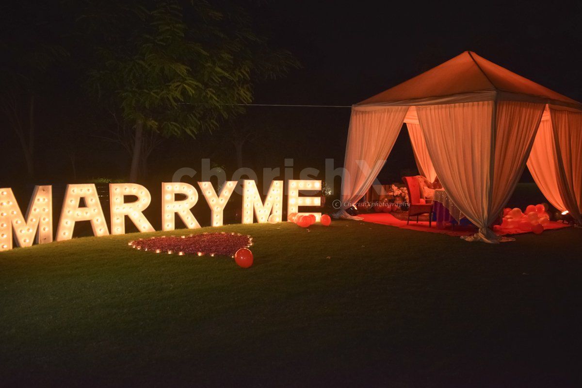 Perfect Proposal Setup with Cabana Setup and Marry Me Letters at Taj Vivanta, Dwarka by CherishX