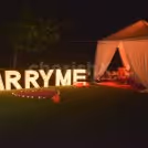Perfect Proposal Setup with Cabana Setup and Marry Me Letters at Taj Vivanta, Dwarka by CherishX