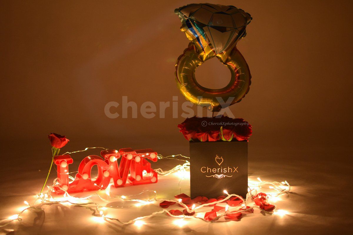 Book a Rose Bucket with a Ring Balloon for your special one.