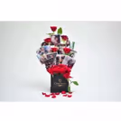 A CherishX's bucket with fresh roses and set up with pictures to gift to your friends or family.