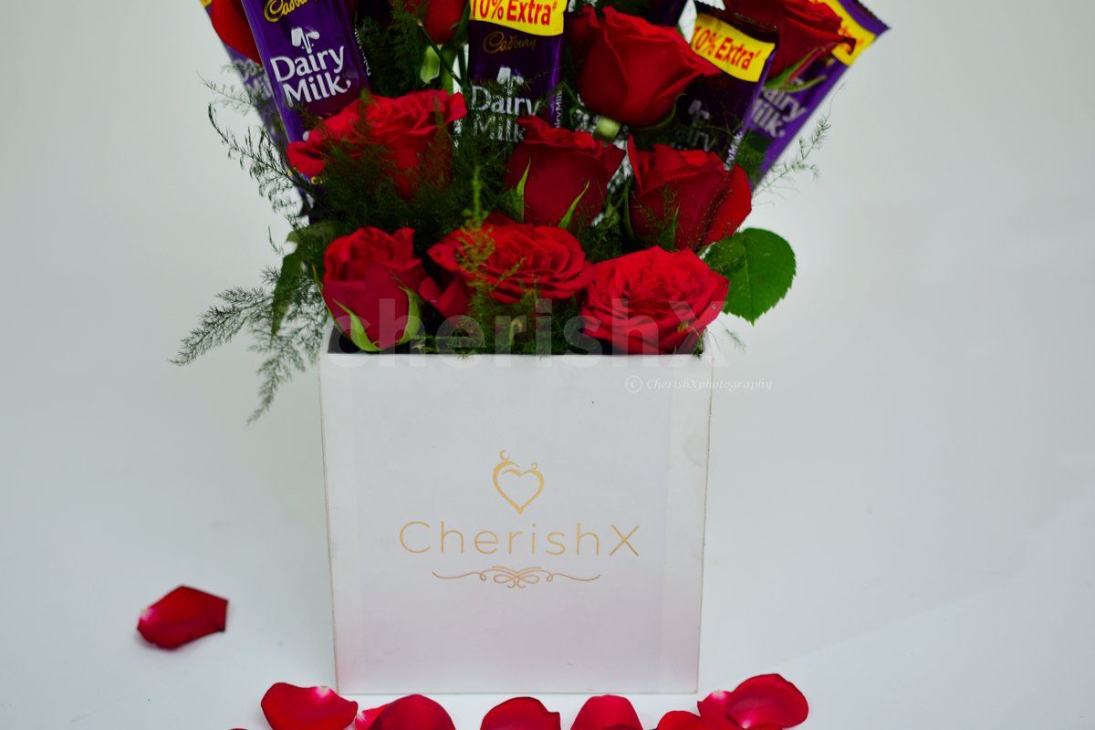 CherishX offers you a charming Rose bucket with chocolates to make his/her day.