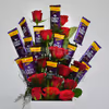 The chocolate and roses are arranged as a flower bouquet.