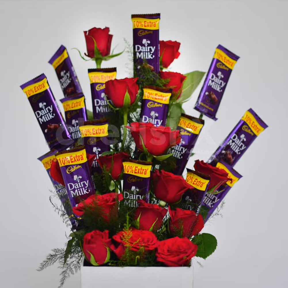The chocolate and roses are arranged as a flower bouquet.