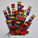 The chocolate and roses are arranged as a flower bouquet.
