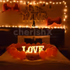 The room decor is specially curated with red balloons and lightings for a romantic feel.