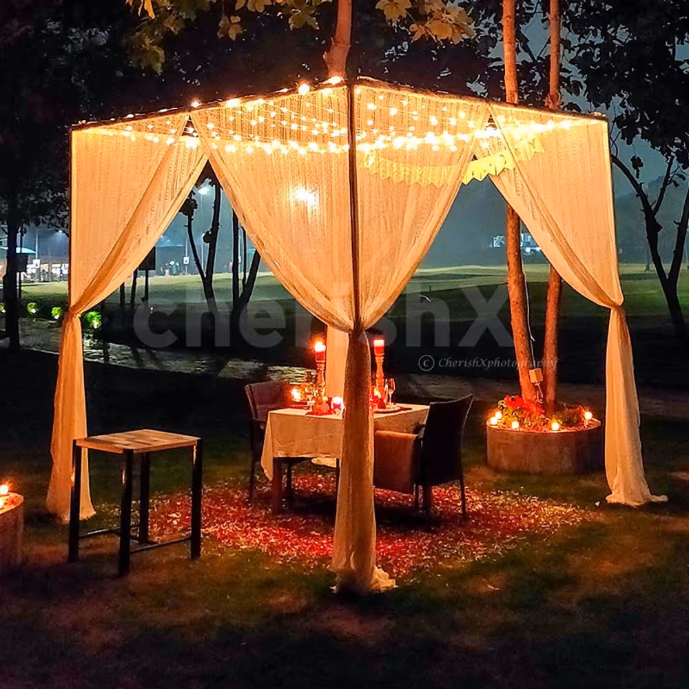Private cabana dining under the stars at Hamoni Gurgaon with golf course views.