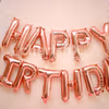 Wall decoration with Pink "Happy Birthday" Foil Balloons.