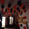 Red and Black Balloon Theme used for Anniversary Special Balloon Room Decoration.