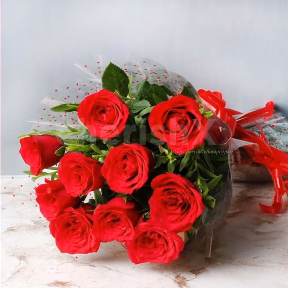 10 red rose bouquet and black forest cake (500 gms)