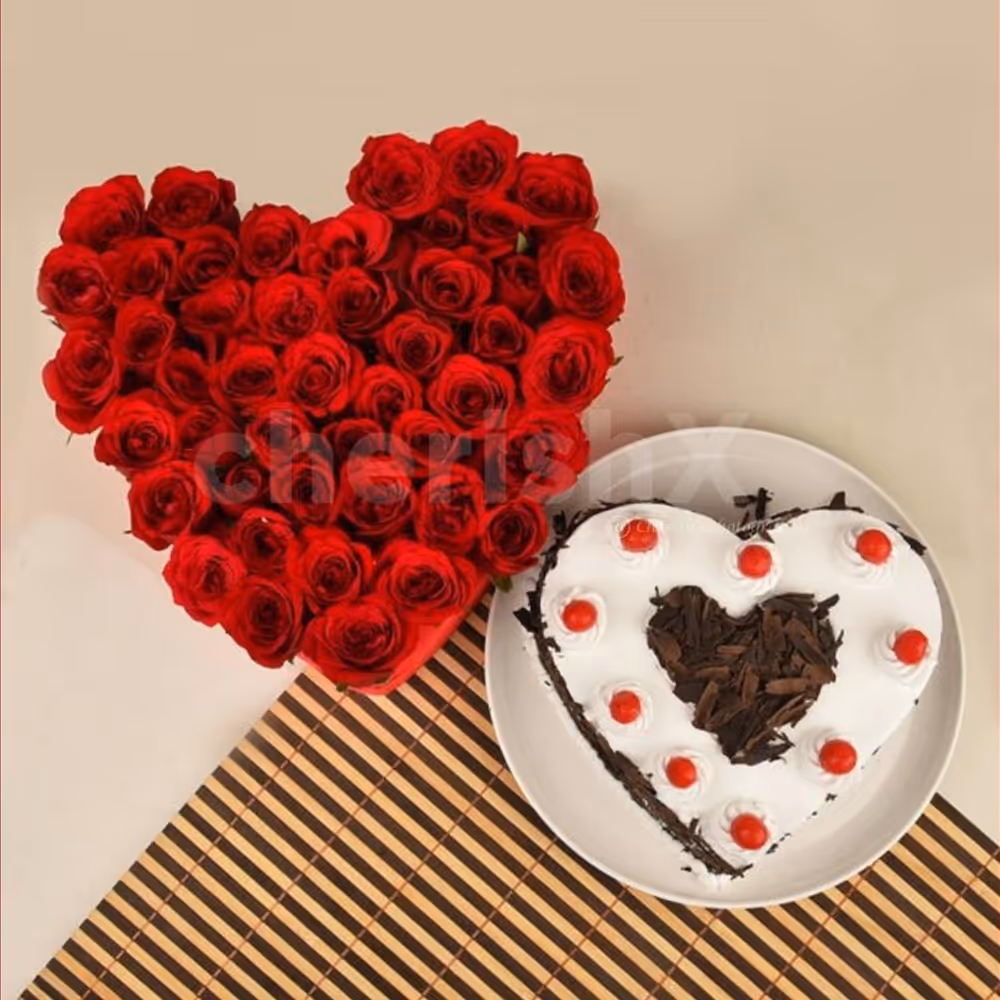 50 Red roses heart arrangement and a heart shape black forest cake
