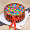 10 roses and Kitkat Gems cake combo delivery at home