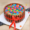 10 roses and Kitkat Gems cake combo delivery at home