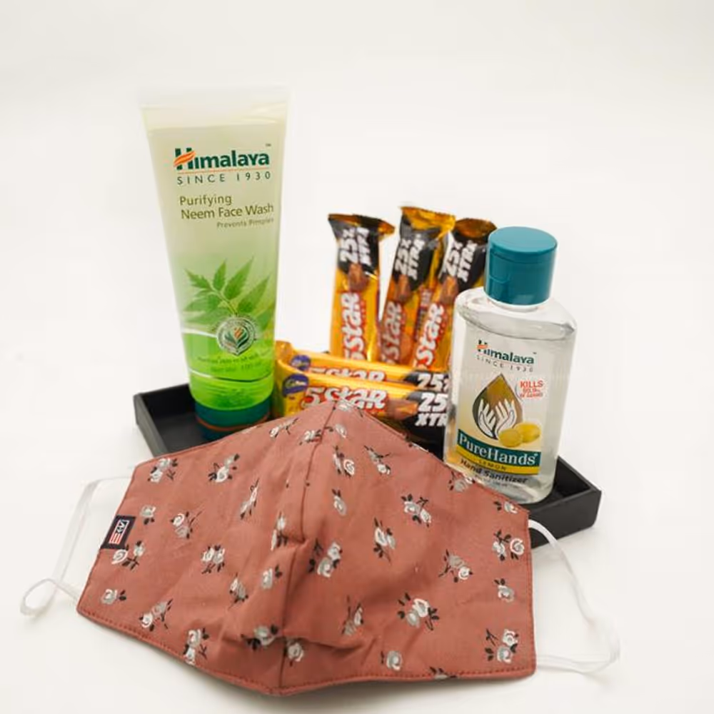 A beautiful bucket consisting of face wash, lip balm, a cotton mask, and chocolates.