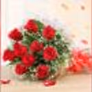 Red roses with a butterscotch cake home delivery by cherishx