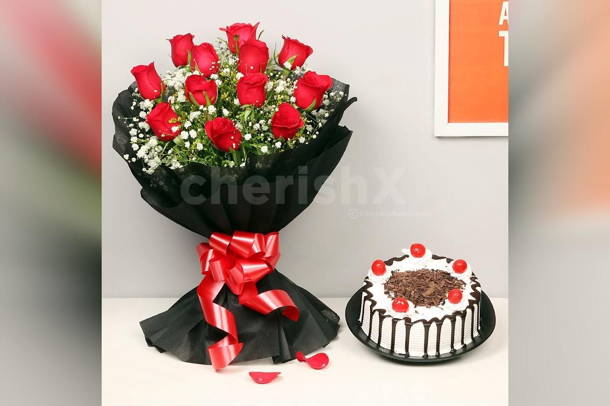 Roses in a black paper packaging with a blackforest cake