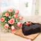 Pink roses with a heart shape chocolate truffle cake